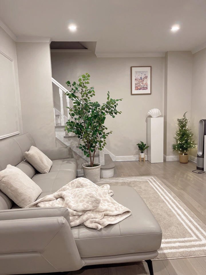 Cozy living space enhanced with white satin laminate pedestal art display